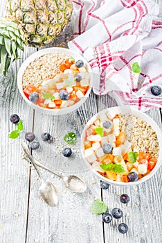 Breakfast oatmeal with tropical fruits