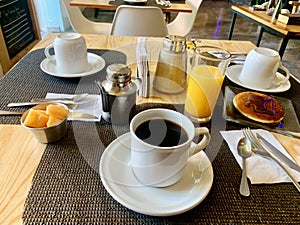 Breakfast with orage juice and coffee photo