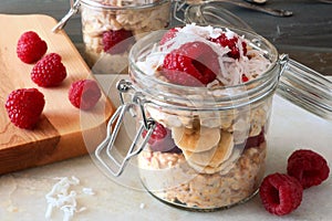 Breakfast overnight oats with fresh raspberries in a jar