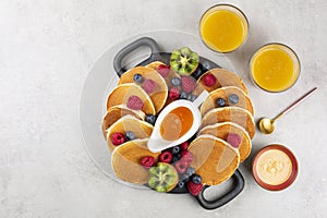 Breakfast pancake board: pancakes, honey