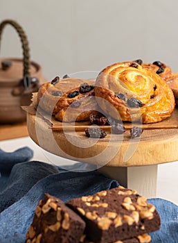 Breakfast pastries of cinnamon buns and chocolate brownies