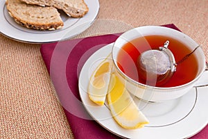 Breakfast with pastries, and hot tea with lemon.