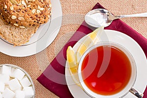 Breakfast with pastries, and hot tea with lemon.