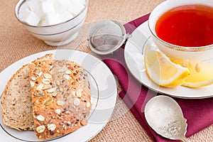 Breakfast with pastries, and hot tea with lemon.
