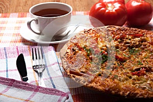Breakfast pizza and tea