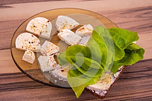 Breakfast plate with green leaf lettuce and cheese