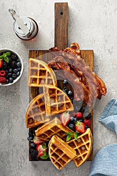 Breakfast platter with waffles, berries and bacon