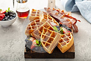 Breakfast platter with waffles, berries and bacon