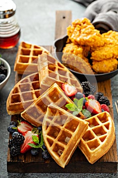 Breakfast platter with waffles, berries and chicken