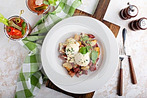 Breakfast potatoes with eggs Benedict and beef