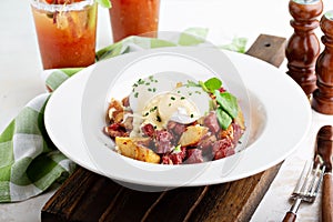 Breakfast potatoes with eggs Benedict and beef