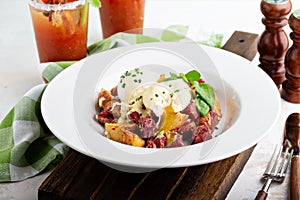 Breakfast potatoes with eggs Benedict and beef