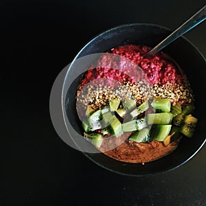 Breakfast: Raspberry chia bowl with kiwifruit, hemp seeds, hazelnut butter