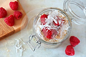 Breakfast refrigerator oatmeal with fresh raspberries and coconut