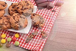 Breakfast with round biscuits with black chocolate top elevated