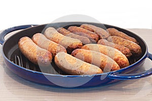 Breakfast sausage in a blue skillet