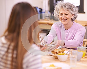 Breakfast, senior and mother with food on dining table for eating with smile for healthy meal and diet. Adult, woman and