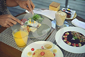 Breakfast served with fried egg, coffee, orange juice, cereals and fruits for healthy