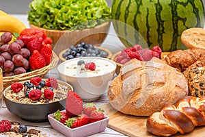 Breakfast Served in the morning with Butter croissant and corn flakes Whole grains and raisins with milk in cups and Strawberry,