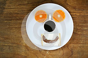 Breakfast serving funny face on the plate