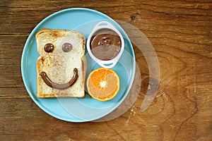 Breakfast serving funny face on the plate