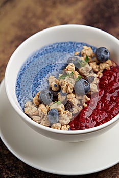 Breakfast smoothie bowl with granola table