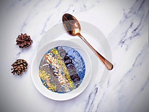 Breakfast smoothie bowl with nuts and fruits