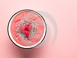 Breakfast smoothie bowl on pink background