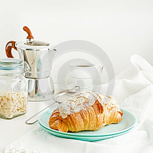 Breakfast and snack background. Fresh croissants and coffee on white table. Square image