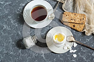 Breakfast. Soft-boiled eggs, cup of coffee and cereal crispbread