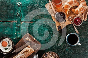 Breakfast spread with coffee, bread and preserves photo