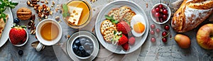 A breakfast spread with fruit, tea, bread, and eggs
