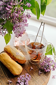 breakfast in spring or summer, purple lilac flowers are fresher on the table.