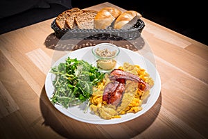 Breakfast table with crambled eggs