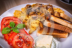 Breakfast table with crambled eggs