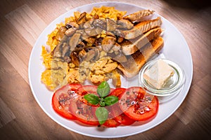 Breakfast table with crambled eggs