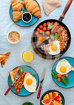 Breakfast table with different healthy food, top view