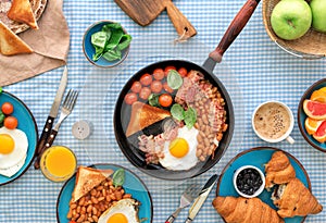 Breakfast table with different tasty and healthy food, top view