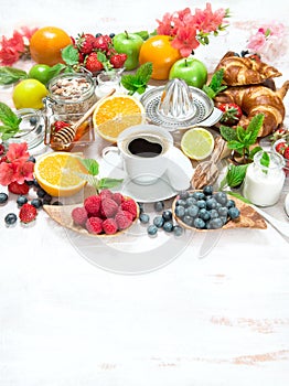 Breakfast table setting with coffee and croissants. Healthy food