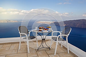 Breakfast table for two on a high terrace