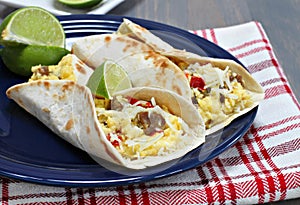 Breakfast tacos with sausage, cheese and peppers