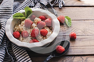 Breakfast. Tasty oatmeal with berries. Healthy breakfast ingredients.