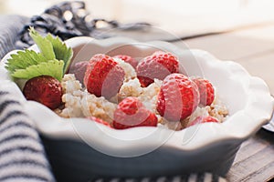 Breakfast. Tasty oatmeal with berries. Healthy breakfast ingredients.