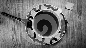 Breakfast tea with chinese spoon, black and white