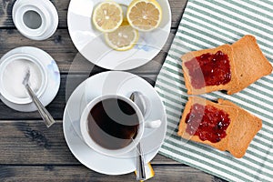 Breakfast with tea and rusks with jam