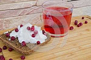 Breakfast with toast with creamcheese berries and fruit tea photo