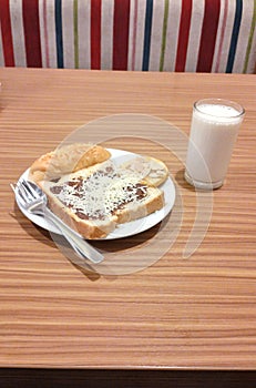breakfast with toast and a glass of milk