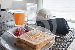 Breakfast with toast, jam and orange juice