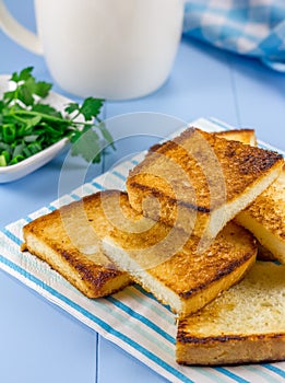 Breakfast toasts with verdure and cup of coffee