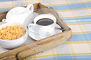 Breakfast tray with coffee and cereals.